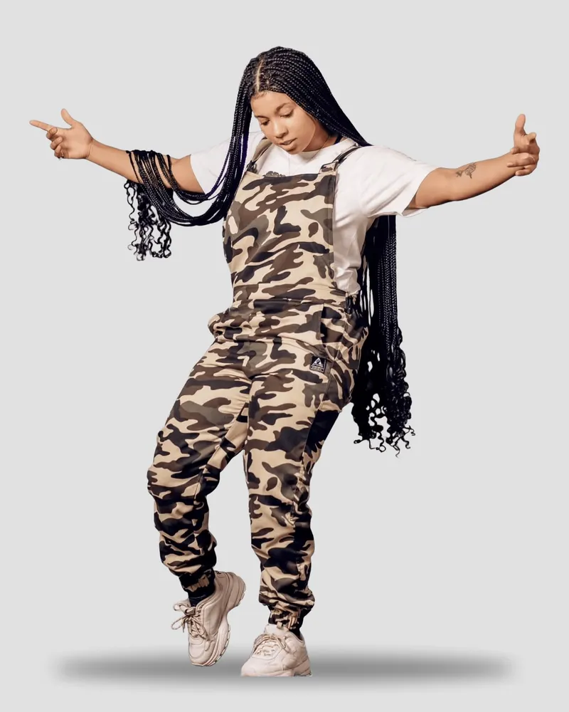 Camo overalls over a white tee