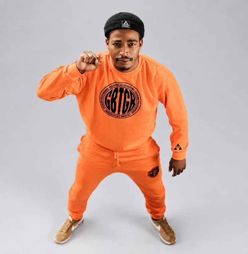 Orange sweatshirt set, raised fist